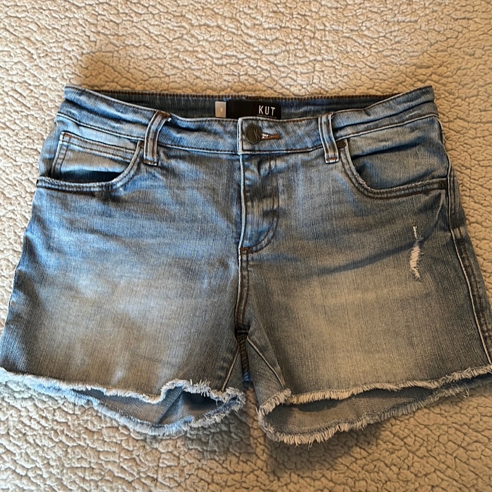Stretch denim mid to high waist 3 inch inseam. Can be rolled up or worn down.